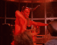 Video gif. A red devil character with ram horns does the booty slap with a pelvic thrust and one arm slapping back and forth.