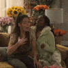 TV gif. Miranda Cosgrove as Carly Shay from iCarly is reeling from some serious drama, and fans herself as she takes a seat on a couch. A supportive friend sitting next to her fans her as well. Text, "Oh my god!"