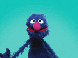 Sesame Street gif. Grover holds up a banner that says, "Congrats," and shakes his head with laughter.