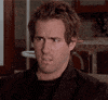 Movie gif. Ryan Reynolds as Chris in Just Friends sits on a sofa in bewildered confusion. He looks up as if searching for clarity on the ceiling.