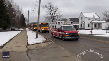 School Buses and Ambulances Seen After Deadly High School Shooting in Oxford, Michigan