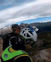 Wingsuit Jumpers Race Down Alpine Mountain in Northern Italy