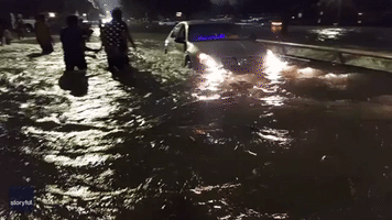 Gully Overflows and Causes Flooding in Houston Amid Multiple Weather Warnings