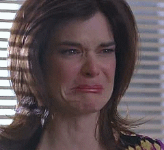 TV gif. Betsy Brandt as Marie on Breaking Bad begins to cry, her eyes welling up in tears.