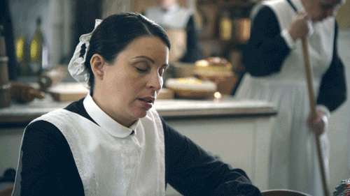 TV gif. Wearing a black dress and white apron, Beth Dover, as Blanche from Another Period begins to nod off, then slaps herself in the face repeatedly to wake up.