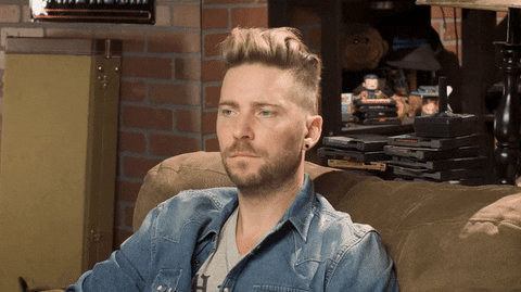RETROREPLAY giphyupload shrug troy baker retro replay GIF
