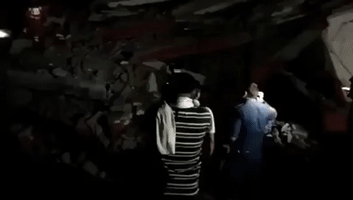 Residents Trapped After Two Buildings Collapse Near Delhi