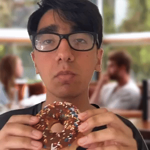 Eating chocolate sprinkles donut