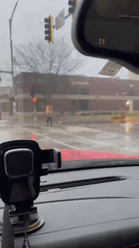 Thinking Outside the Box: Pedestrian Uses Cardboard Box as DIY Rain Shield