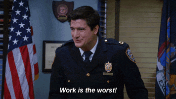 TV gif. Ken Marino as Jason in Brooklyn Nine-Nine says, "Work is the worst," which appears as text, as he squints his eyes and sticks out his tongue goofily.