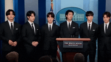 V and Jungkook react during press conference.