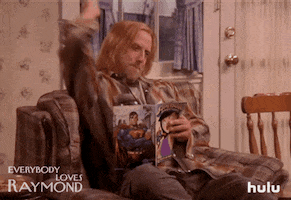TV gif. Chris Elliot as Peter in Everybody Loves Raymond extends his arm out then pulls it back and mouths the sound Boom as if he just shot a gun.