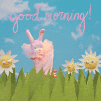 Video gif. Shiny bunny puppet waves at us from a grassy hill with flowers next to it on a bright blue day. Text, "Good morning!"