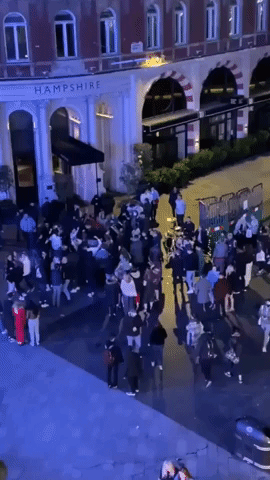Londoners Party in Leicester Square Amid Early Closing for Pubs