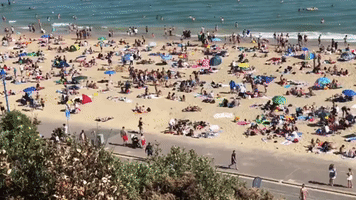 Beachgoers 'Packed in Like Sardines' as High Temperatures Hit England
