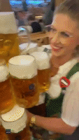 Oktoberfest Waitress Carrying Giant Beer Order