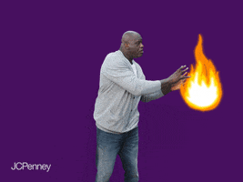 Celebrity gif. Shaquille O'Neal picks up an animated ball of fire and shoots it up in the air like it’s a basketball, focused as if he were making a shot on the court.