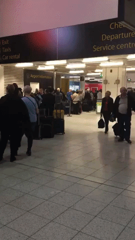 Gatwick Passengers Wait While Flights Grounded by Drones