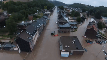 Rescue Crews at Work in Belgian Town as Streets and Cars Submerged