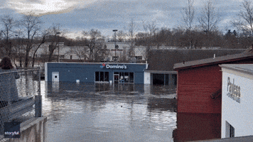 Emergency Team Rescues Men Trapped in Flooded Domino's