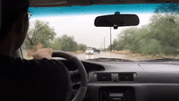 Drivers Navigate Flooded Roads in Arizona