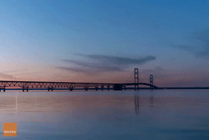 Glorious Northern Lights Seen Dancing in Timelapse Shot over Michigan's Mackinac Bridge