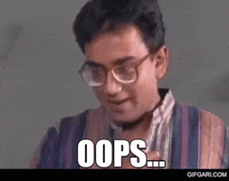 Celebrity gif. Young Humayun Ahmed, a Bangledeshi novelist, is shocked but laughing as he clasps both hands over him mouth in glee. Text, "Oops."