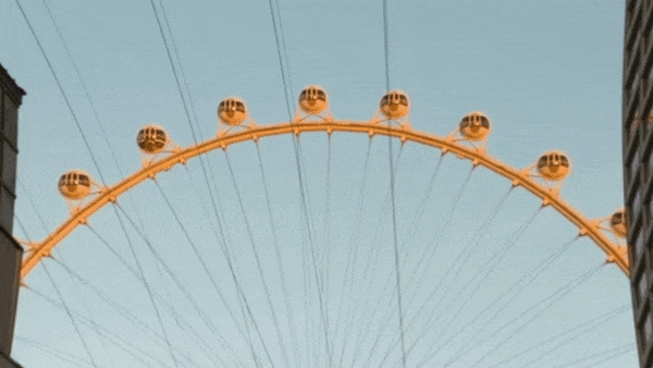 Video gif. People ziplining between two tall buildings, with a large ferris wheel in the background. Text springs up and reads, "Leap into the weekend."