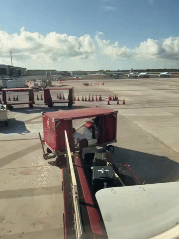 Airline Pilot Helps Load Baggage onto Key West Flight