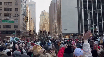 Crowds Cheer on New York Streets for Macy's Thanksgiving Day Parade