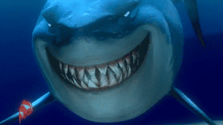 Cartoon gif. Bruce the shark from Finding Nemo shows rows of sharp teeth as he gives Marlin a scary smile. Text, "Hello."