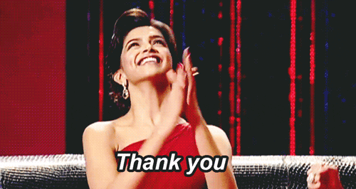 Celebrity gif. Deepika Padukone on Koffee with Karan, an Indian talk show. She looks grateful and happy as she claps and puts her hands out, saying, "Thank you."