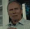 Movie gif. An older Clint Eastwood looks right of frame with disapproval. He lowers a white mug as he slowly turns away to the left.