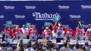 Joey Chestnut Grabs Protester at Hot Dog Contest