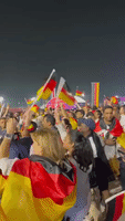Fans Cheer Outside Al Bayt Stadium 