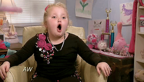 Reality TV gif. Honey Boo Boo on Here Comes Honey Boo Boo sits in a chair with her hands spread out onto the arm rests. She looks up with wide eyes as she says, “Awwwwwessssooooome.”