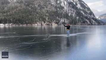 Man Travels Mary Poppins-Style Across Frozen Lake