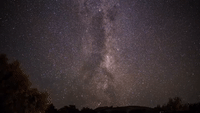 Astrophotographer Captures Shooting Stars Streaking Pass Spinning Galaxy in Timelapse