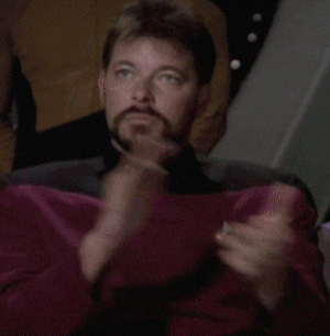 Star Trek gif. Jonathan Frakes as William T. Riker claps heartily, but his face is stoic and expressionless.