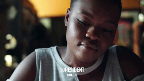 the resident smile GIF