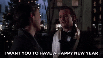 Movie gif. Bill Murphy as Frank in Scrooged tells a man, "I want you to have a happy new year," which appears as text, and then he walks away leaving the man behind.