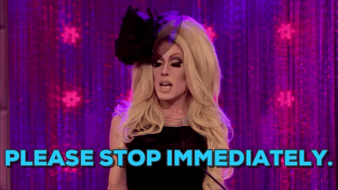 TV gif. Alaska 5000 on RuPaul's Drag Race wearing a black dress, gloves and tulle fascinator, looks at someone, shaking his hands, and saying, "Please stop immediately."