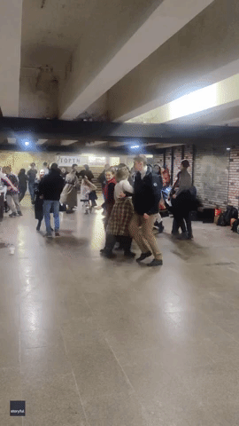 People in Kyiv Underground Station Dance to Traditional Music in Between Air Raids
