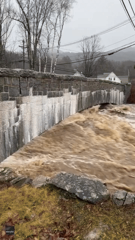 Rapid Currents of Flood Water Batter Mountain Town As Ellis River Swells