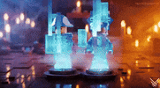 Video game gif. LEGO characters undergoing a holographic transformation. They're standing on circular bases, surrounded by glitching blue holographic panels. The background is a dimly lit room with a warm, ambient glow.