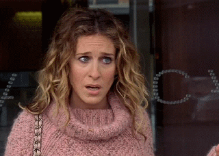 TV gif. Sarah Jessica Parker as Carrie on Sex and the City looks shocked and stunned as leans forward and her jaw drops. 