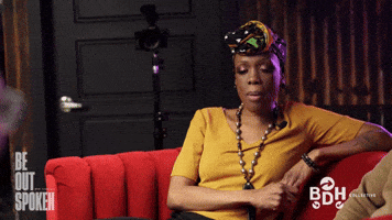 Woman in orange talking