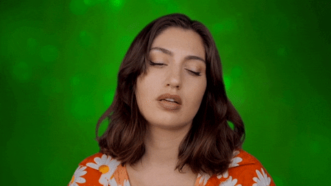 Video gif. Groggy woman with heavy eyes nods off, too tired to stay awake.