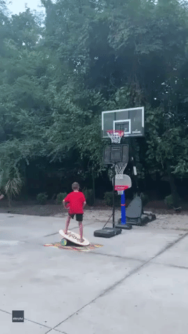 8-Year-Old Baller Masters Basketball Balancing Trick Shot
