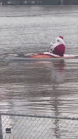 Santa Spotted Kayaking Through Flood